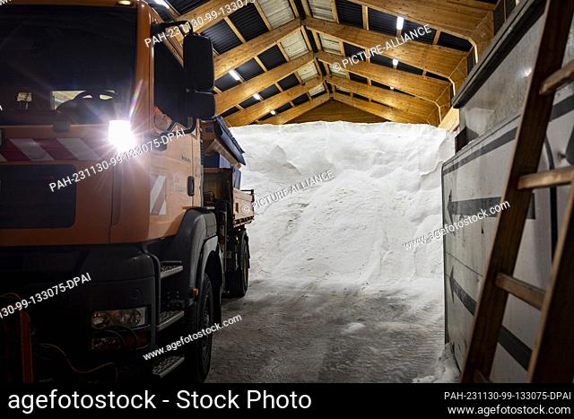 30 November 2023, North Rhine-Westphalia, Lüdenscheid: An Autobahn GmbH truck is parked in the large salt depot of the highway maintenance depot