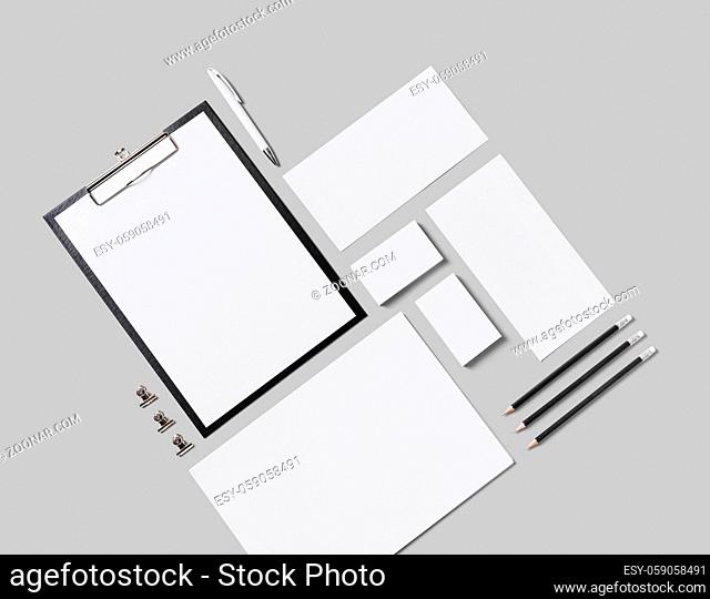 Blank corporate stationery set on gray background. Corporate identity template. Responsive design mockup. Isolated with clipping path. Flat lay