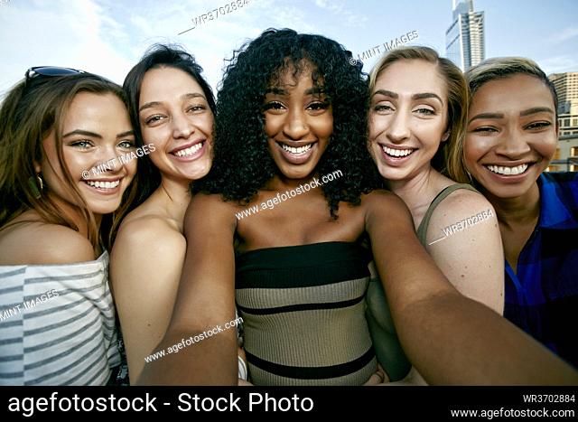 A group of five young women posing for a selfie