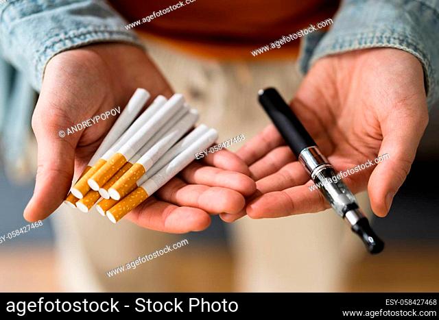 Smoking Tobacco E Cigarette. Holding Tobacco Vape