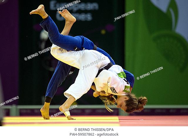 Germanys Mareen Kraeh (white) competes with Tetyana Levytska of Ukraine in the Women's -52kg Judo quarterfinal at the Baku 2015 European Games in Heydar Aliyev...