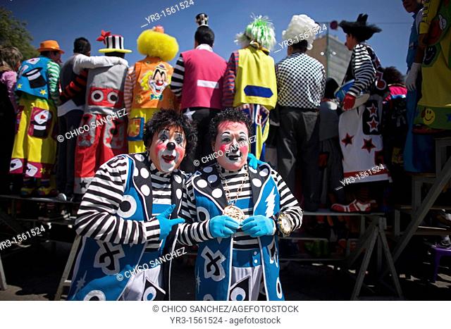 Twin clowns pose for a picture during the 16th International Clown Convention: The Laughter Fair organized by the Latino Clown Brotherhood, in Mexico City