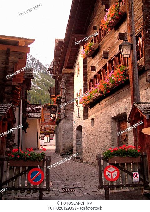 Switzerland, Europe, valais, wallis, Val d'Anniviers, Grimentz, old chalets along a narrow pedestrian street, gate, no motor vehicles