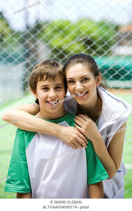 Mother and son outdoors, portrait