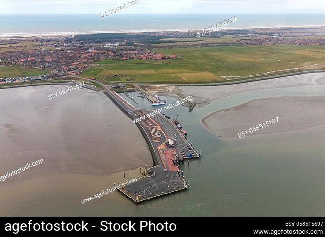 Aerial view ferry terminal with low tide at Dutch island Ameland in Wadden Sea