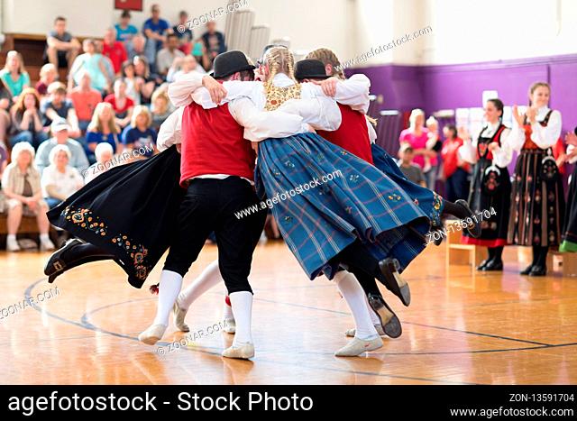 Stoughton, Wisconsin, USA - May 19, 2018 The Stoughton Norwegian Dancers, wearing traditional clothing from norway, perform traditional dances at the Community...