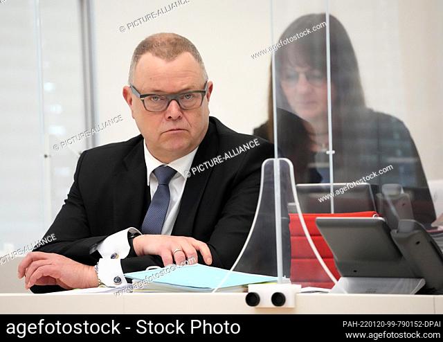 20 January 2022, Brandenburg, Potsdam: Michael Stübgen (CDU), Minister of the Interior and for Local Affairs, follows the topical hour during the state...