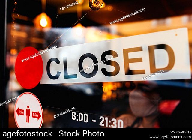 Signboard with Closed text at the cafe through glass window. High quality photo