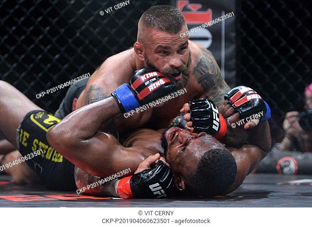 Czech MMA fighter Karlos Vemola (up) fights with French fighter Prince Aounallah during the Night of Warriors gala evening on April 6, 2019, in Liberec