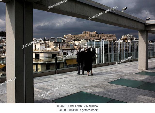 Visitors take phots of the Acropolis from the roof of the National Musuem for Contemporary Art (EMST) in Athens, Greece, 7 April 2017