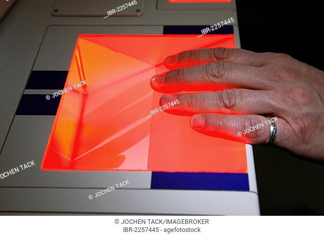 A suspect's fingerprints are taken at the police, scanning of fingerprints and palm prints, criminal investigation department of the police, Germany, Europe