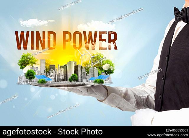 Waiter serving eco city with WIND POWER inscription, renewabke energy concept