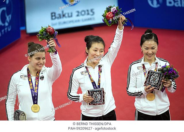 Germany's Petrissa Solja, Ying Han and Xiaona Shan (L-R) present their gold medals after winning in the Women's table tennis team Final against the Netherlands...