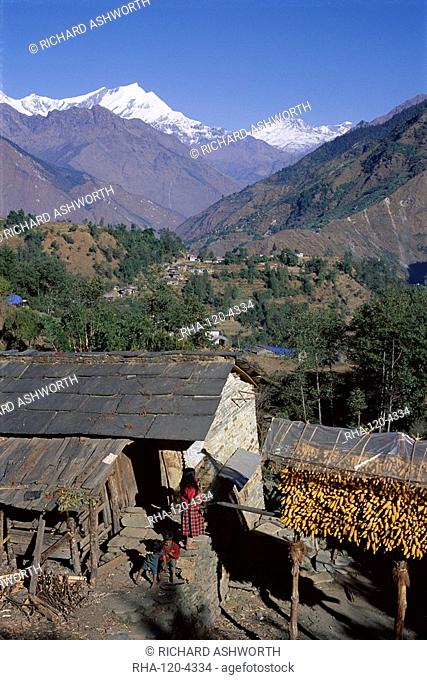 Corn hanging to dry outside village house, Sikha village, and view looking north between Tatopani and Ghorepani on the Jomsom Jomson Trek, north of Pokhara