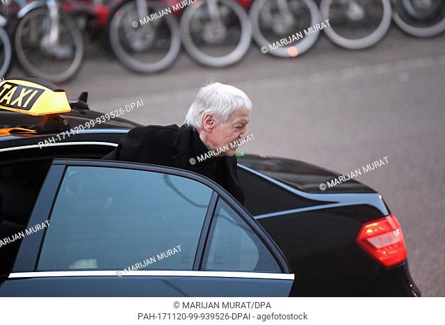 The former owner of the chain of chemist shops Schlecker, Anton Schlecker, steps out of a black taxi on arrival at the regional court in Stuttgart, Germany