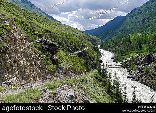 Oroi Bridge on the Chuya River. End of the Mazhoy Cascade. August. Surroundings of the village of Chibit, Altai, Siberia, Russia