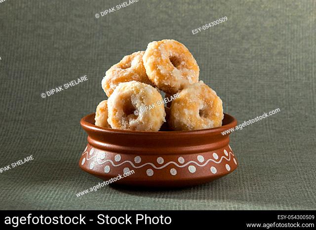 Indian Traditional Sweet Food Balushahi on a grey textured background