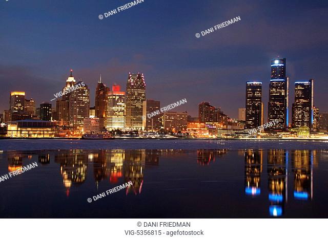 Skyline of downtown Detroit, Michigan, USA illuminated at night. Ice can be seen floating in the Detroit River. Detroit is known as The Motor City, The D