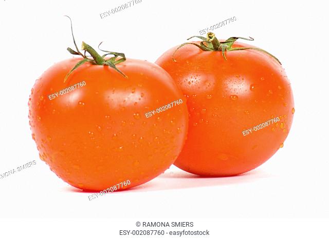 two fresh tomatoes with waterdrops