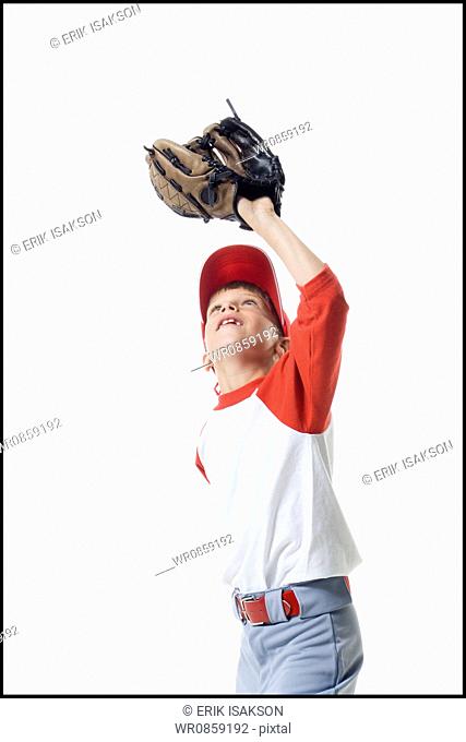 Close-up of a baseball player catching a baseball