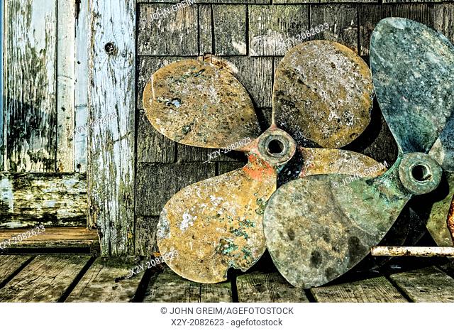 Old boat propellers on a fishing village dock, Menemsha, Martha's Vineyard, USA
