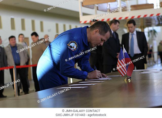 At the Gagarin Cosmonaut Training Center in Star City, Russia, Expedition 3334 prime crew member Flight Engineer Kevin Ford of NASA signs in for the first of...