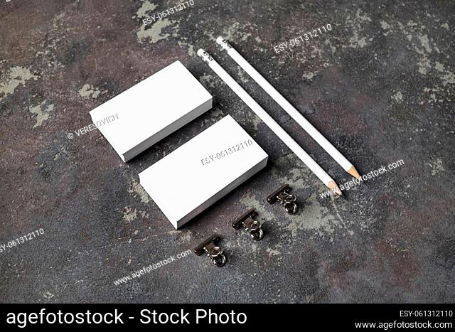 Blank business cards and pencils on concrete background. Template for ID