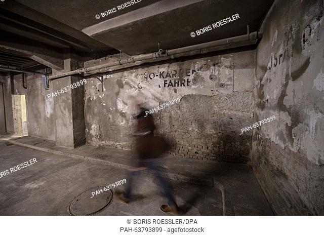 A man walks through the newly opened Holocaust .Memorial site in the cellar of the European Central Bank in Frankfurt, Germany, 20 November 2015