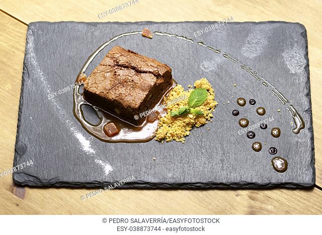 Chocolate brownie with cereals and mint