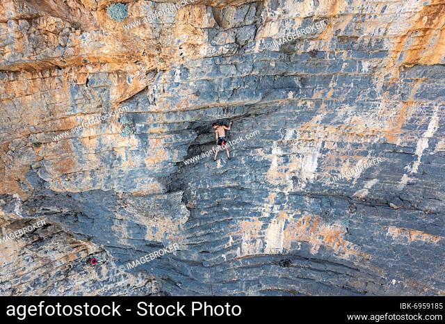 Climber climbing on a rock face, sport climbing, Telendos, near Kalymnos, Dodecanese, Greece, Europe