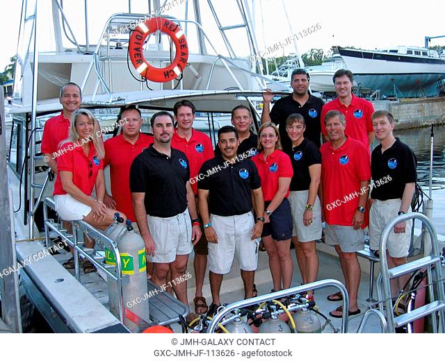 NEEMO 12 crewmembers and the topside team for the 12th NASA Extreme Environment Mission Operations (NEEMO) project take a break from training to pose for a...