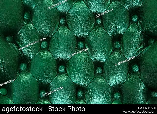 Genuine leather upholstery background for a luxury decoration in green tones