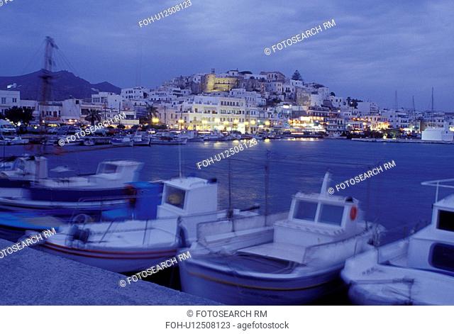 Naxos, Greece, Greek Islands, Cyclades, Europe, Fishing boats docked in Hora Naxos Harbor in the evening on Naxos Island on the Aegean Sea