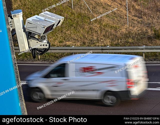 25 February 2021, Brandenburg, Storkow: The KESY automatic number plate recognition system is installed on a bridge over the Autobahn 12 between Berlin and...