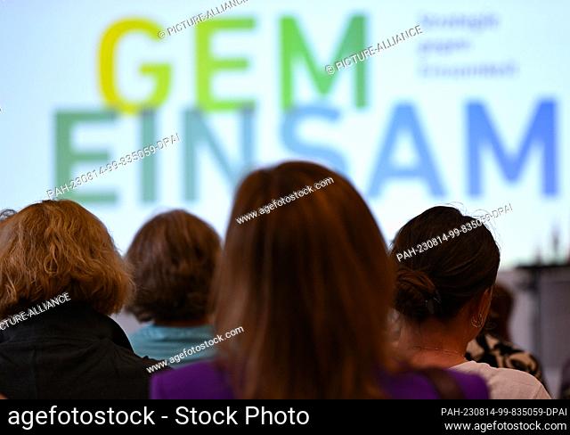 14 August 2023, Hesse, Frankfurt/Main: People listen during a townhall discussion between Goethe University students and citizens and Federal Minister for...