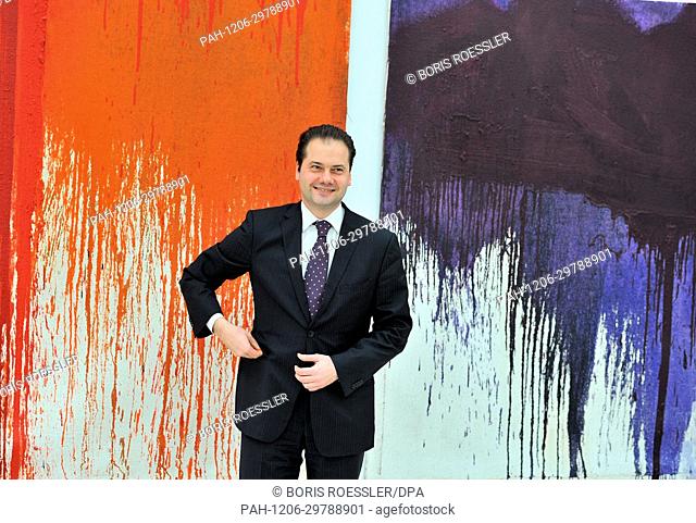 Max Hollein, director of the Staedel, stands in front of ""Painting Action - Red"" and ""Painting Action - Violet"" by Hermann Nitsch in the newly opened...