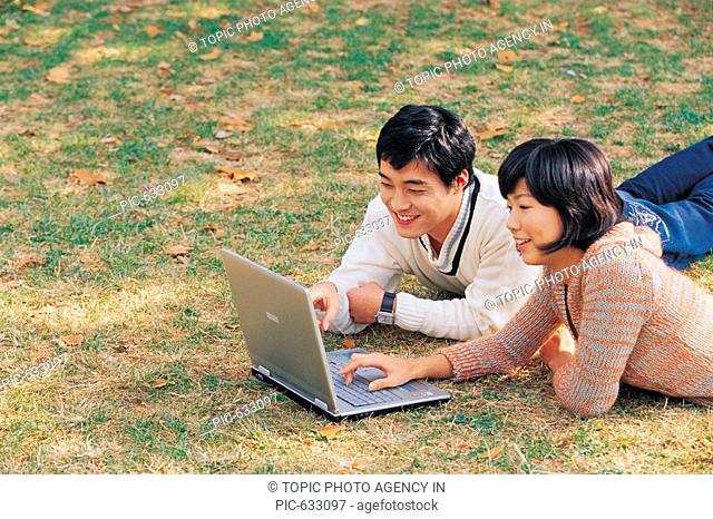 Young Korean People Enjoying Picnic at Park