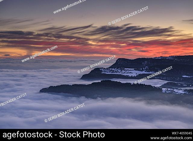 Capolat high plateau and Les Tres Maries mountains in a winter sunset with a sea of clouds over the central region of Catalonia (Berguedá , Catalonia, Spain