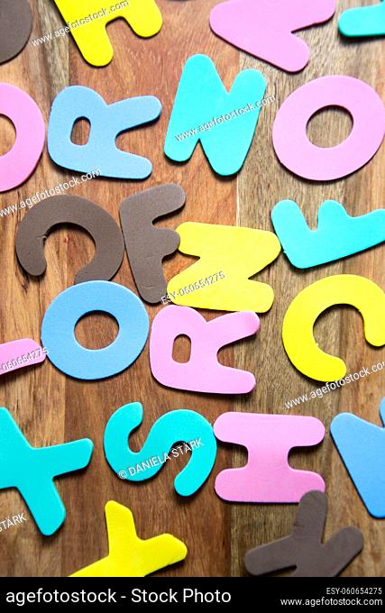 colorful letters on wooden background