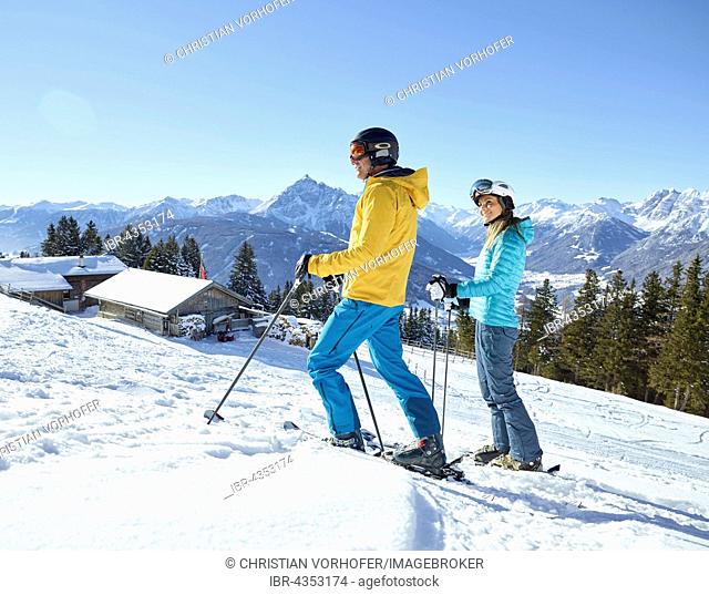 Woman and man, couple hiking with snowshoes in a snowy landscape, Patscherkofel, Patsch, Innsbruck, Tyrol, Austria