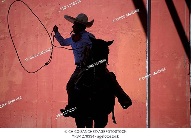 A Mexican charro practices his lasso at the National Charro Championship in Pachuca, Hidalgo State, Mexico. Escaramuzas are similar to US rodeos