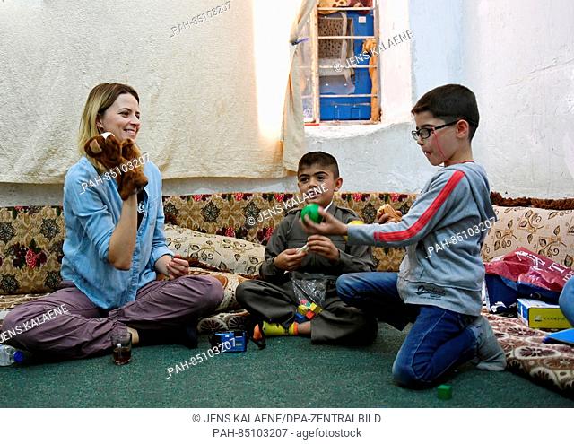 EXCLUSIVE - UNICEF ambassador Eva Padberg visits the family of nine-year-old Murat (C) in a refugee camp for Syrian refugees in the Dohuk region, Iraq