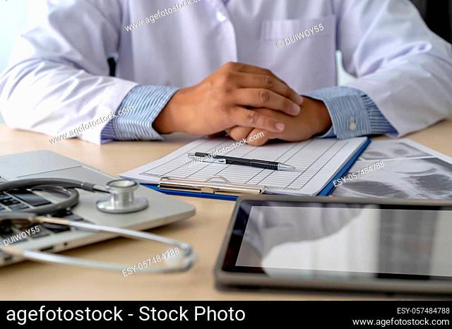 Health care writing prescription Doctor working with laptop computer