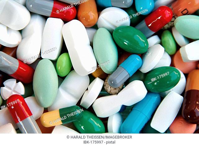 Many different colourful pills and capsules