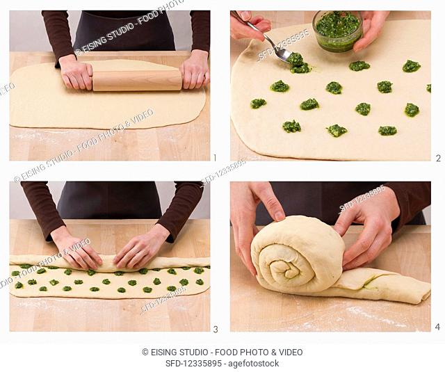 Snail-shaped pesto bread being made