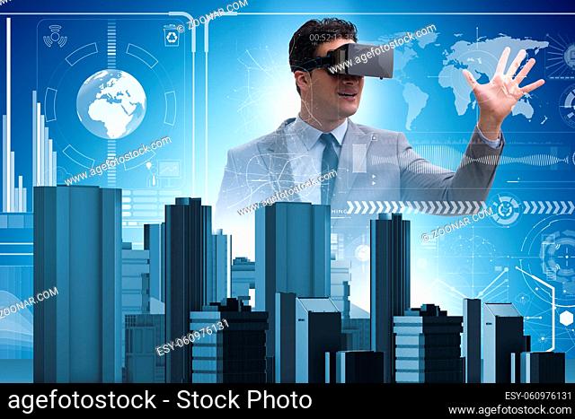 Man with virtual reality goggles doing urban planning