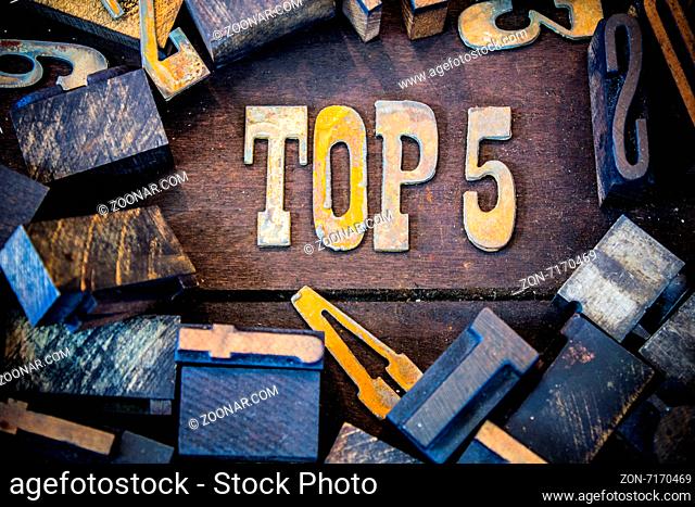 The words TOP 5 written in rusted metal letters surrounded by vintage wooden and metal letterpress type