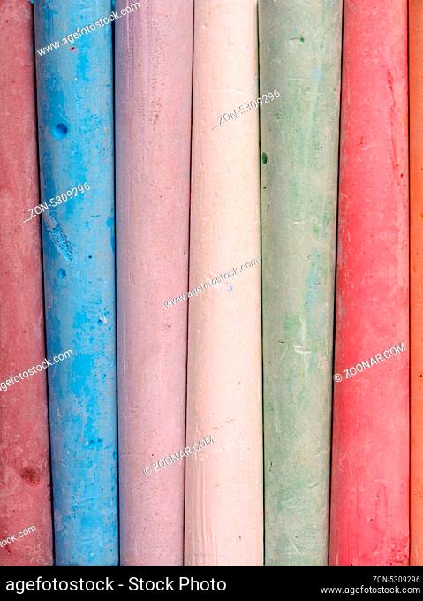 Close up of multicolored chalk sticks together