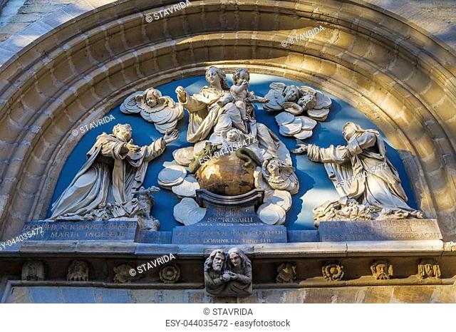 Bas-relief above the entrance gates of the church of St. Paul with the image of the saints. Antwerp. Belgium