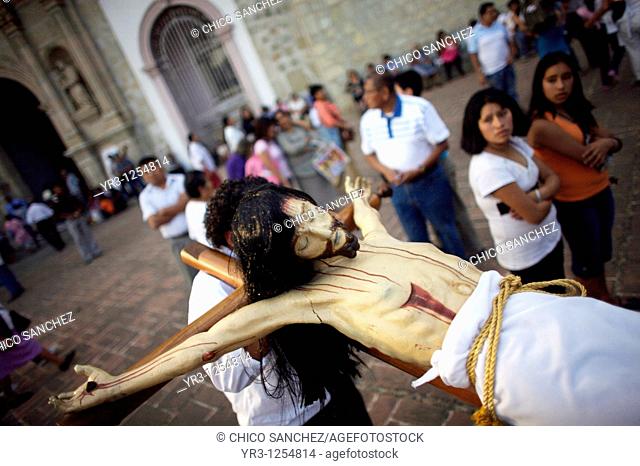 Men carry a statue of a crucified Jesus Christ during holy week celebrations in Oaxaca, Mexico